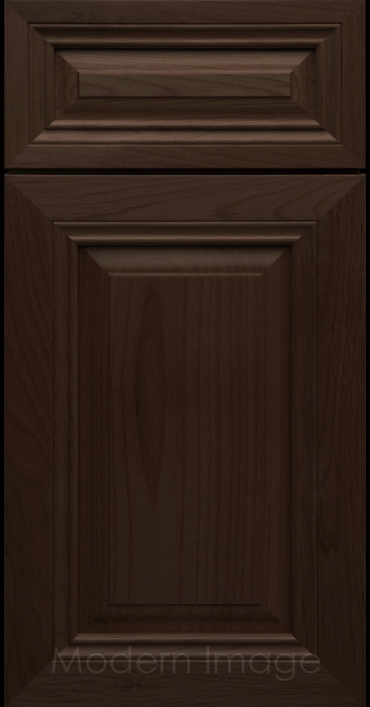 Close-up of a Brownie-stained wood cabinet door with a mitered frame and traditional Cambridge raised center panel.